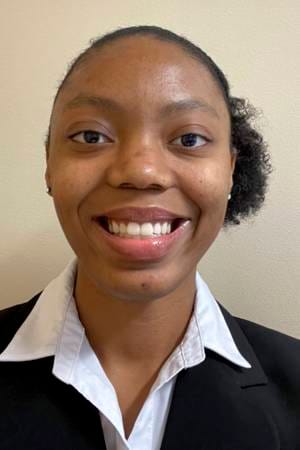 Lauren Arnao copy - 05252021 - 1015 - Resized Portrait of Lauren Arnao wearing a black blazer and white collared shirt, smiling