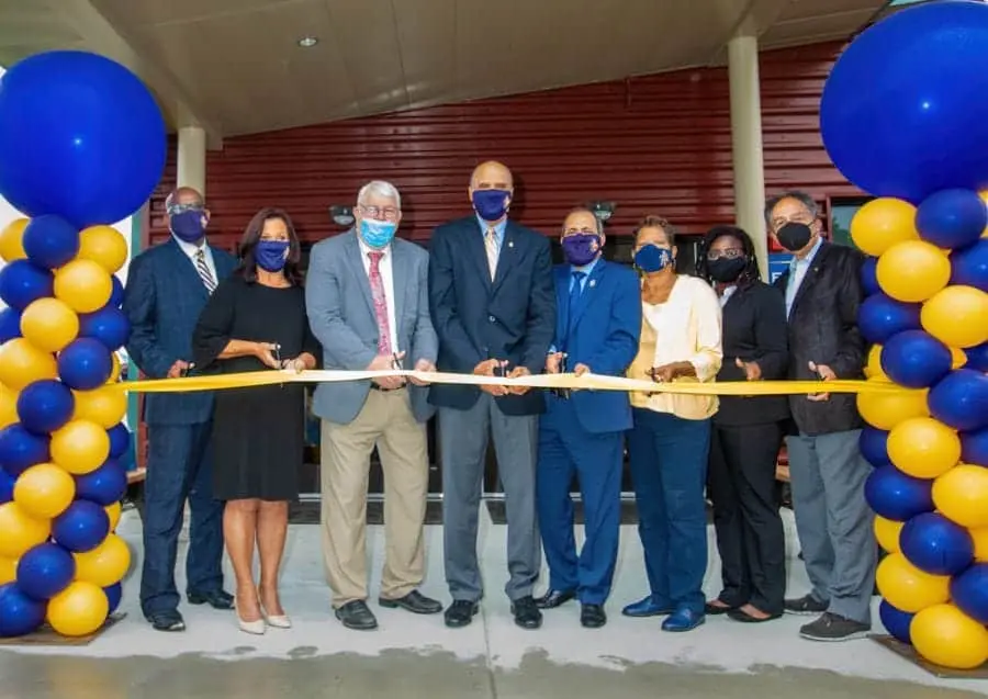 High-level officials participate in ribbon-cutting ceremony at CAES News event.