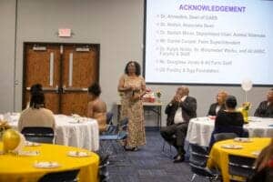 Empowering women in agriculture at CAES News event with speaker and attendees.